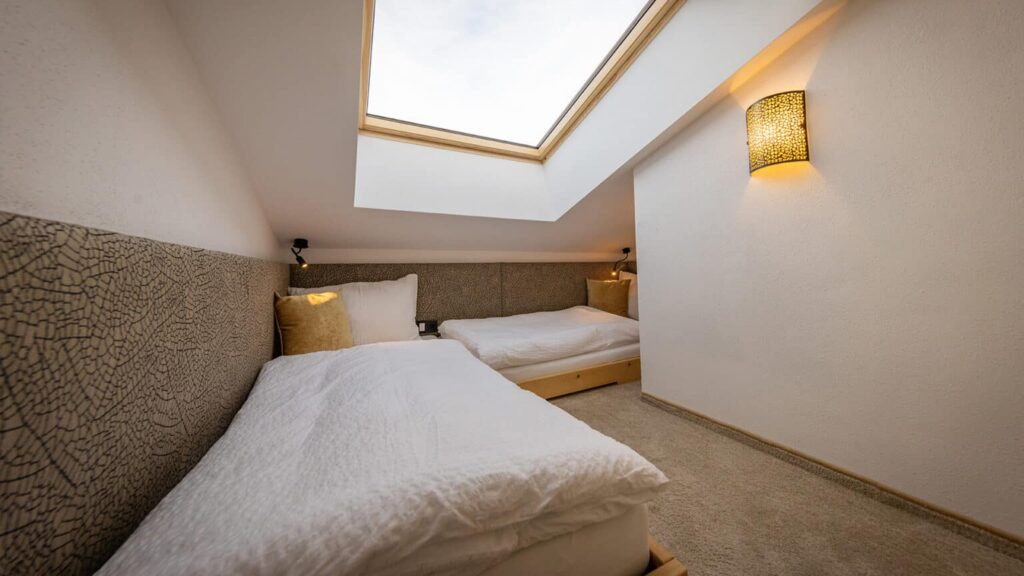 Penthouse bedroom with single beds