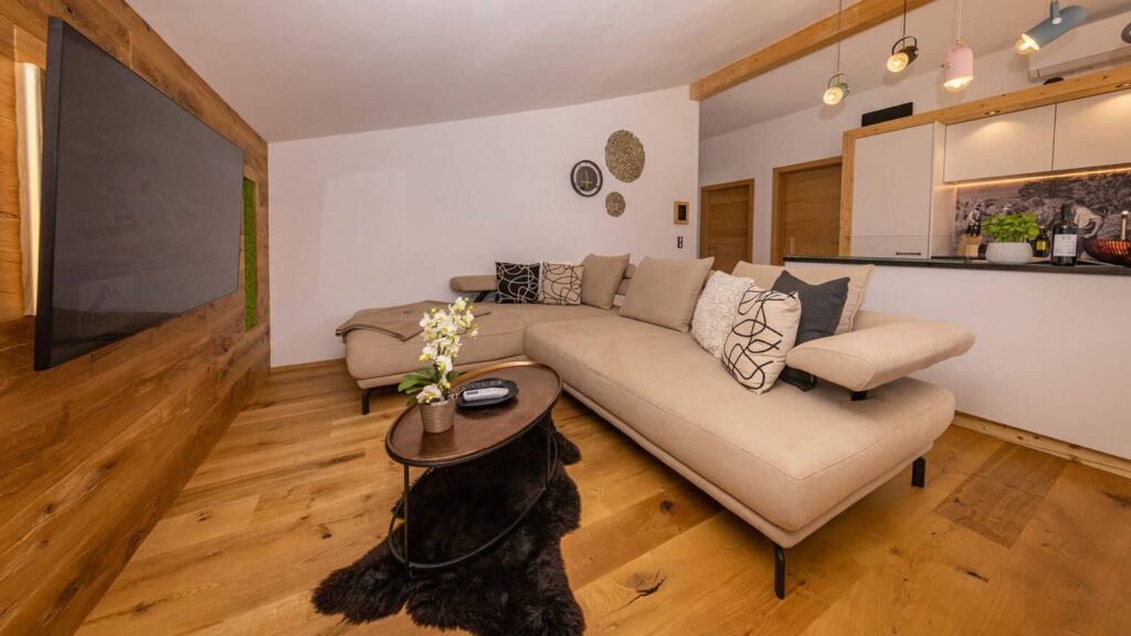 Penthouse living area with kitchen island, smart TV and dishwasher
