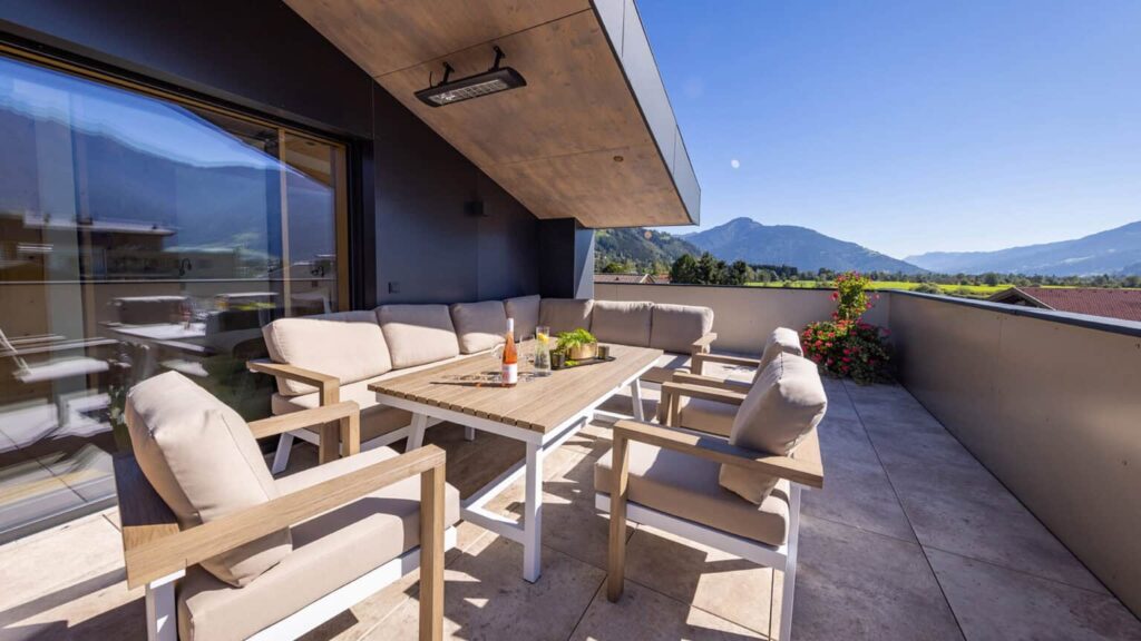 Penthouse terrace with lounge furniture and view of the Kitzsteinhorn glacier
